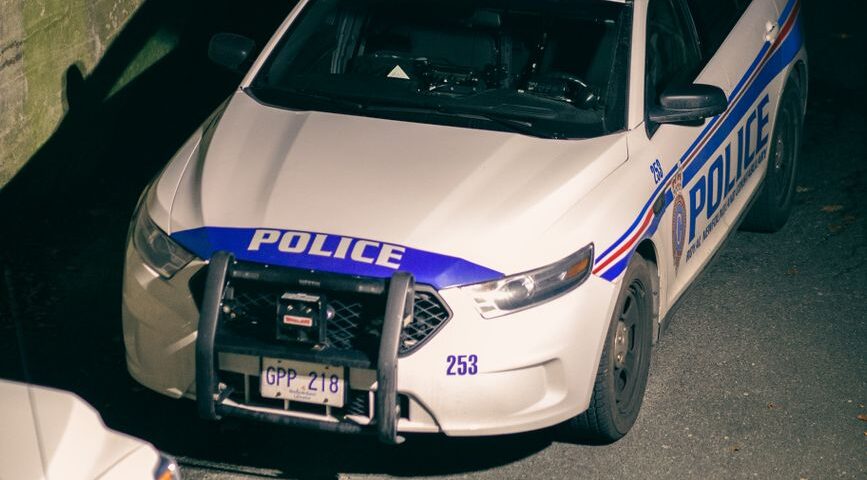 police car on road in night town
